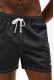 Tommy Hilfiger ανδρικό μαγιό short (κοντού μήκους) σε μαύρο χρώμα με το λογότυπο της εταιρείας , άνετη γραμμή 100%polyester UM0UM03852-BDS